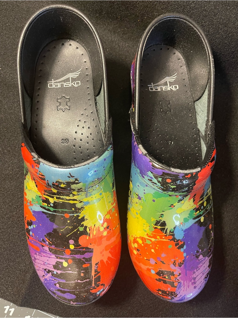 Dansko Multicolor Paint-Splash Clogs in Black Base